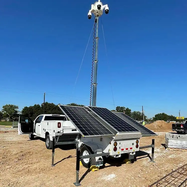 Mobile surveillance trailer with solar security cameras secures a jobsite, showing mobile video security for commercial and parking lot security needs.